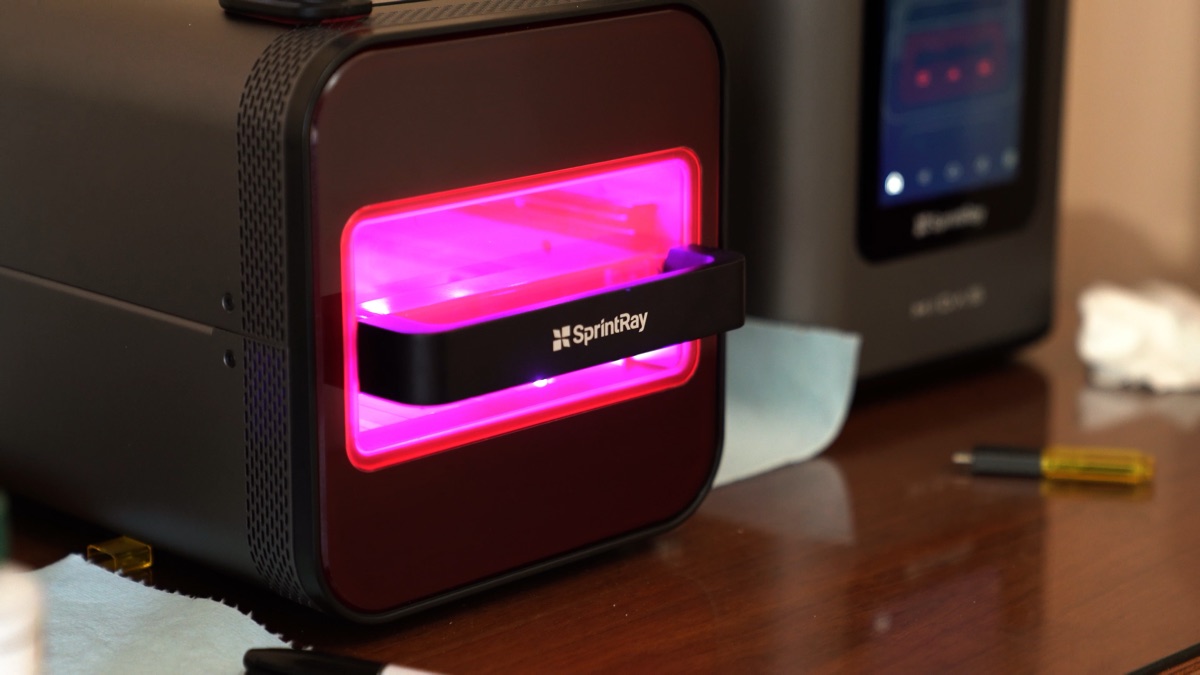 A SprintRay 3D printer producing restorations in the on-site digital lab